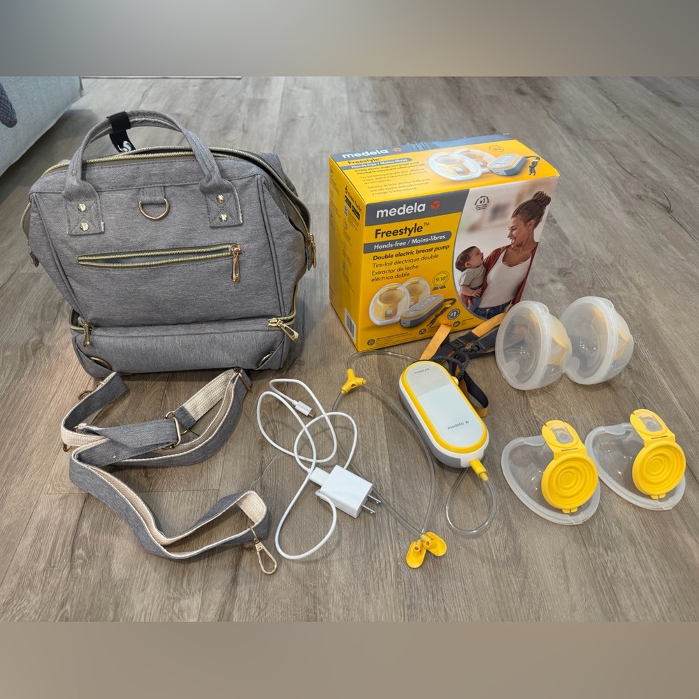 Medela breast pump with carry bag and extra set of parts